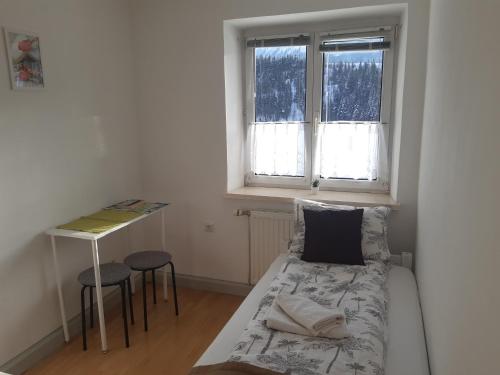 Postel nebo postele na pokoji v ubytování Four Seasons Apartment Josef