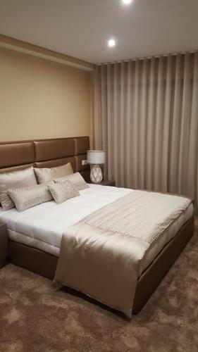a bedroom with a large bed in a room at Casa das Oliveiras, o Douro no seu esplendor! in Cinfães