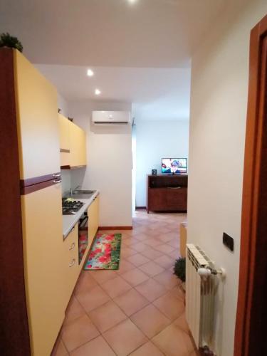 a kitchen with a counter and a stove top oven at Old Factory in Omegna