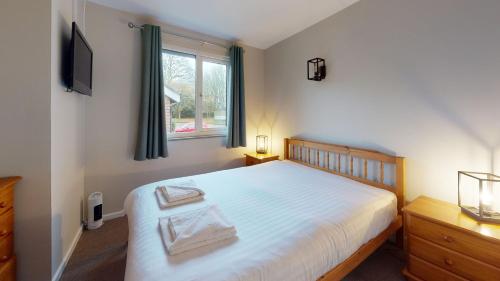 Ένα ή περισσότερα κρεβάτια σε δωμάτιο στο 45 Strawberry Hill, Tolroy Manor