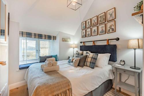 a bedroom with a large bed and a window at The Chapel in Stow on the Wold