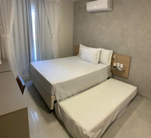 En eller flere senge i et værelse på Liiv Mar - Natal Ponta Negra