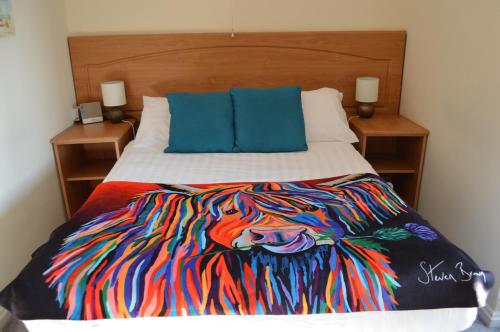 Katil atau katil-katil dalam bilik di Hunters Lodge Hotel
