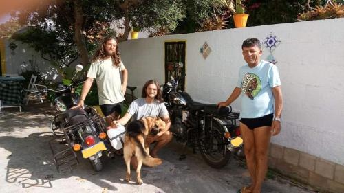 a group of people with a dog and a motorcycle at Zagara di Sicilia in Marsala