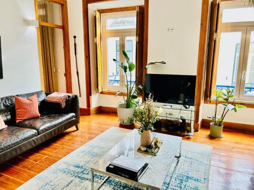 a living room with a couch and a coffee table at Bairro Alto in Lisbon