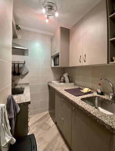 a kitchen with a sink and a counter top at Estudio Sol del Mar in Torrox
