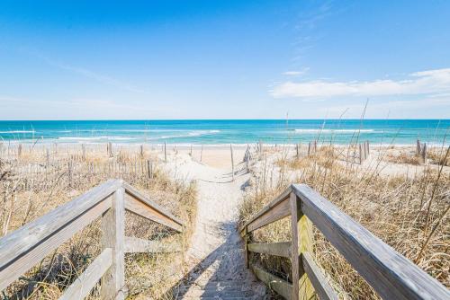 a stairway to the beach with the ocean in the background at Coker Cabana in Sanderling