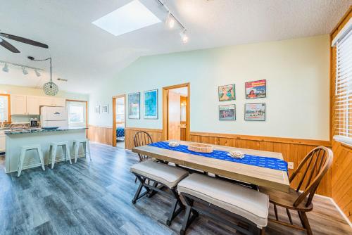 a kitchen and dining room with a table and chairs at Coker Cabana in Sanderling