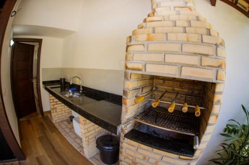 Η κουζίνα ή μικρή κουζίνα στο Magnífica casa, peró,Cabo Frio