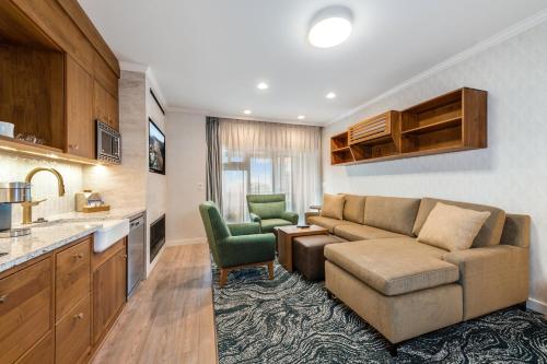 a living room with a couch and two chairs at Hallmark Resort in Cannon Beach in Cannon Beach