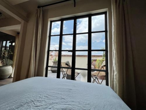 Postel nebo postele na pokoji v ubytování Casa Realm