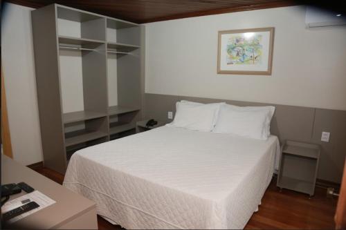 Ένα ή περισσότερα κρεβάτια σε δωμάτιο στο Letto Hotel Flores da Cunha