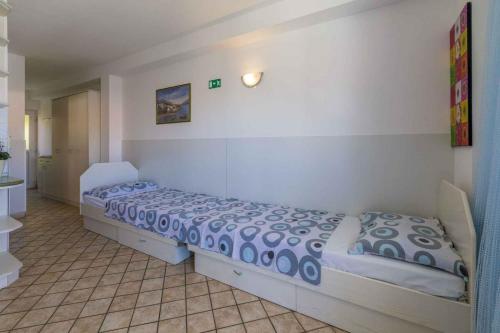 a bedroom with two beds in a room at One-Bedroom Apartment in Crikvenica XI in Dramalj