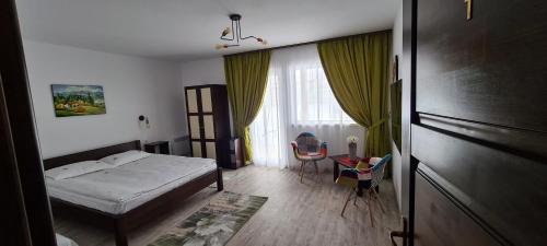 Postel nebo postele na pokoji v ubytování Cabana Floare de Colt 2