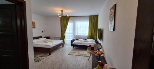 Postel nebo postele na pokoji v ubytování Cabana Floare de Colt 2