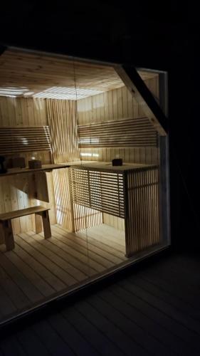 an empty room with a table and a glass window at Apartamenty Sielanka in Olecko