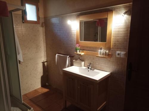 a bathroom with a sink and a mirror at casas rurales ivan el penas 3 in Letur