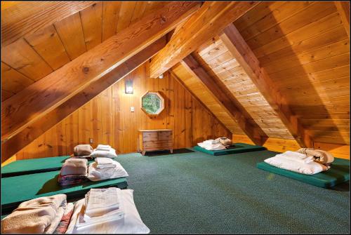 a room with three beds in a attic at Brundage Bungalows in McCall