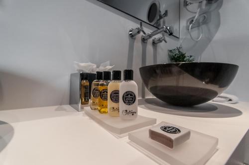 a bathroom counter with a black bowl and a sink at Hotel Sorli Emocions in Vilassar de Dalt