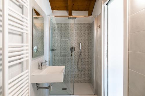 a bathroom with a sink and a shower at Casa degli Ulivi - Ossuccio, Tremezzina by LoveComo in Isola Comacina