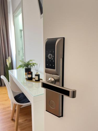 a hotel room with a refrigerator with a table and a microwave at Corso Venezia in Mestre