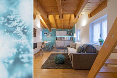 a living room and a dining room and a kitchen at La Casa di Trento in Trento