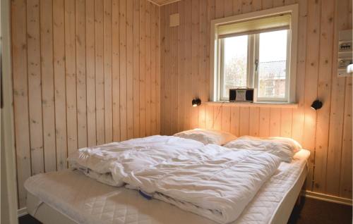 a bed in a room with a window at Holiday Home Hovborgvej Hus in Tofterup