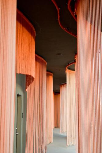 a row of pink curtains in a hallway at Skyview Hotel in Torrey