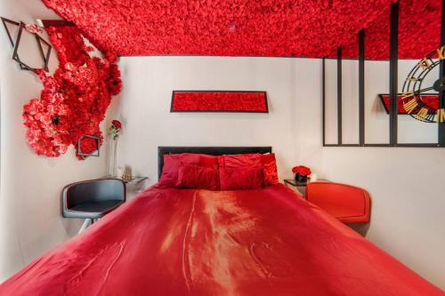 a red bed in a white room with red furniture at Romance in Leicester City Center in Leicester
