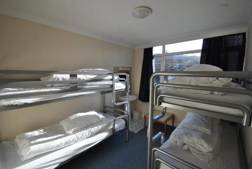 
A bunk bed or bunk beds in a room at Saucy Mary's Hostel

