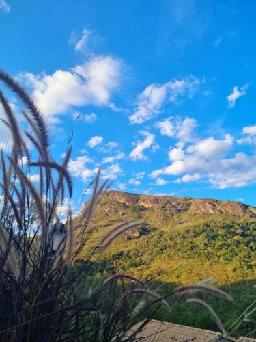 a view of a hill with a blue sky and clouds at Recanto Serra do Trovão in Ouro Preto