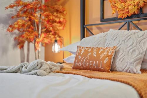 a bed with a fall pillow on top of it at *The 4Seasons:Themed Retreat w/Hot Tub-Pool Table* in Decatur