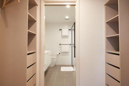 a bathroom with a toilet and a shower at Tranquility the Beach in Huskisson