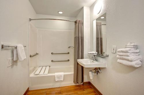 a bathroom with a shower and a sink at Motel 6-Sunnyvale, CA - North in Sunnyvale