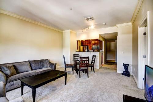 a living room with a couch and a table at Harbor apartments Free indoor Parking in Baltimore