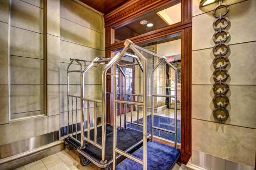 a hallway with a metal staircase in a house at Chase at 39 West Convention Center Inner Harbor Free Parking in Baltimore