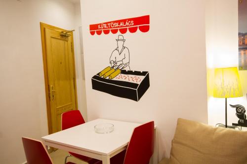 a room with a table and a sign on the wall at Apartamentos El Templo Suites in Merida