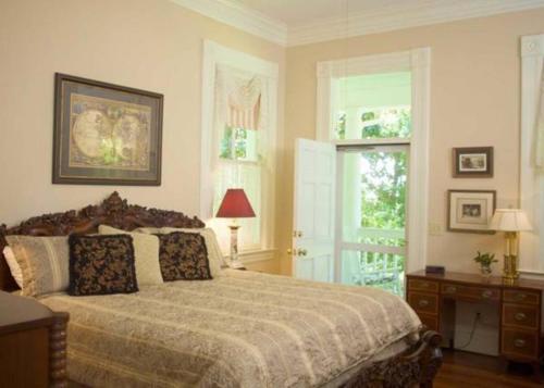a bedroom with a large bed and a window at Lookaway Inn in North Augusta