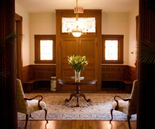 a room with a table with a vase of flowers at Lookaway Inn in North Augusta