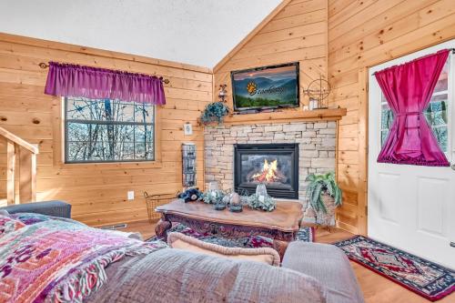 a living room with a fireplace and a couch at Amberwood- Get 951 worth of FREE area attraction tickets for each paid day!!! in Sevierville
