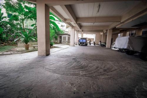 an empty parking lot with a truck parked in a garage at We Residence Studio in Pattaya Central