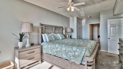 a bedroom with a bed and a ceiling fan at 401 North Tower home in Myrtle Beach