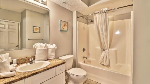 a bathroom with a sink and a toilet and a shower at 401 North Tower home in Myrtle Beach