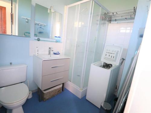 a bathroom with a toilet and a shower and a sink at Studio Le Grau-du-Roi, 1 pièce, 4 personnes - FR-1-307-20 in Le Grau-du-Roi