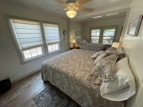a bedroom with a bed and a ceiling fan at Cherry Street Star in Bandera