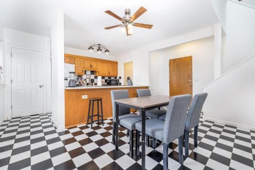 a kitchen and dining room with a table and chairs at Exquisite Downtown Loft Apartment in Hartford