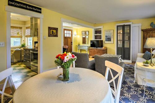 a living room with a table with a vase of flowers on it at Bainbridge Island Abode Less Than 1 Mi to Winslow! in Winslow
