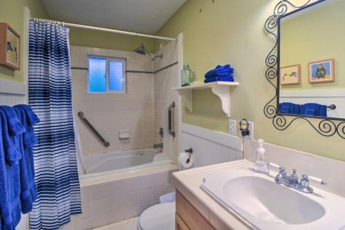 a bathroom with a sink and a tub and a toilet at Bainbridge Island Abode Less Than 1 Mi to Winslow! in Winslow