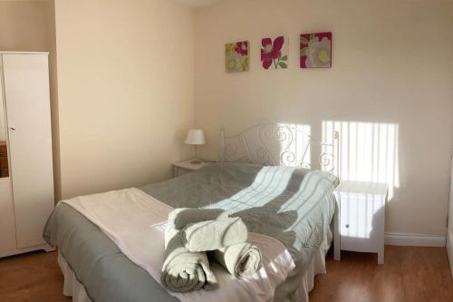 a bedroom with a bed with towels on it at Challoner House - sleeps 5 in Hartlepool