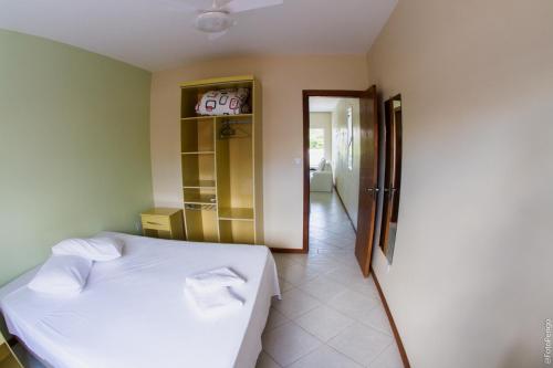 Apartamentos Praia Campeche 50m do mar 객실 침대
